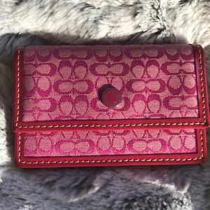 Pink Coach card holder.